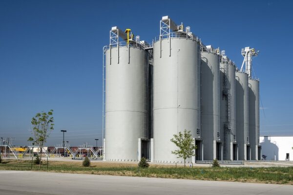 ten Tarsco epoxy-coated bolted tanks tower over a building